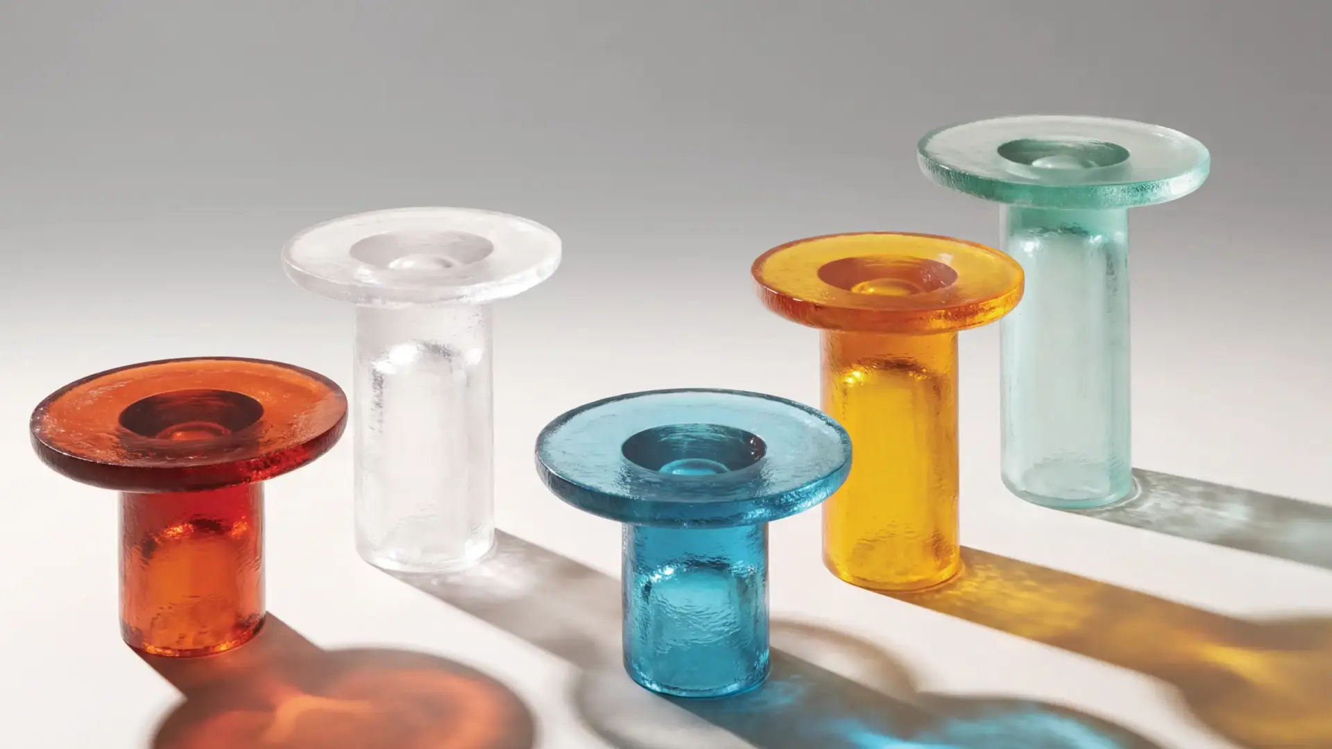 Coloured glass side tables in amber, turquoise, coral and clear glass