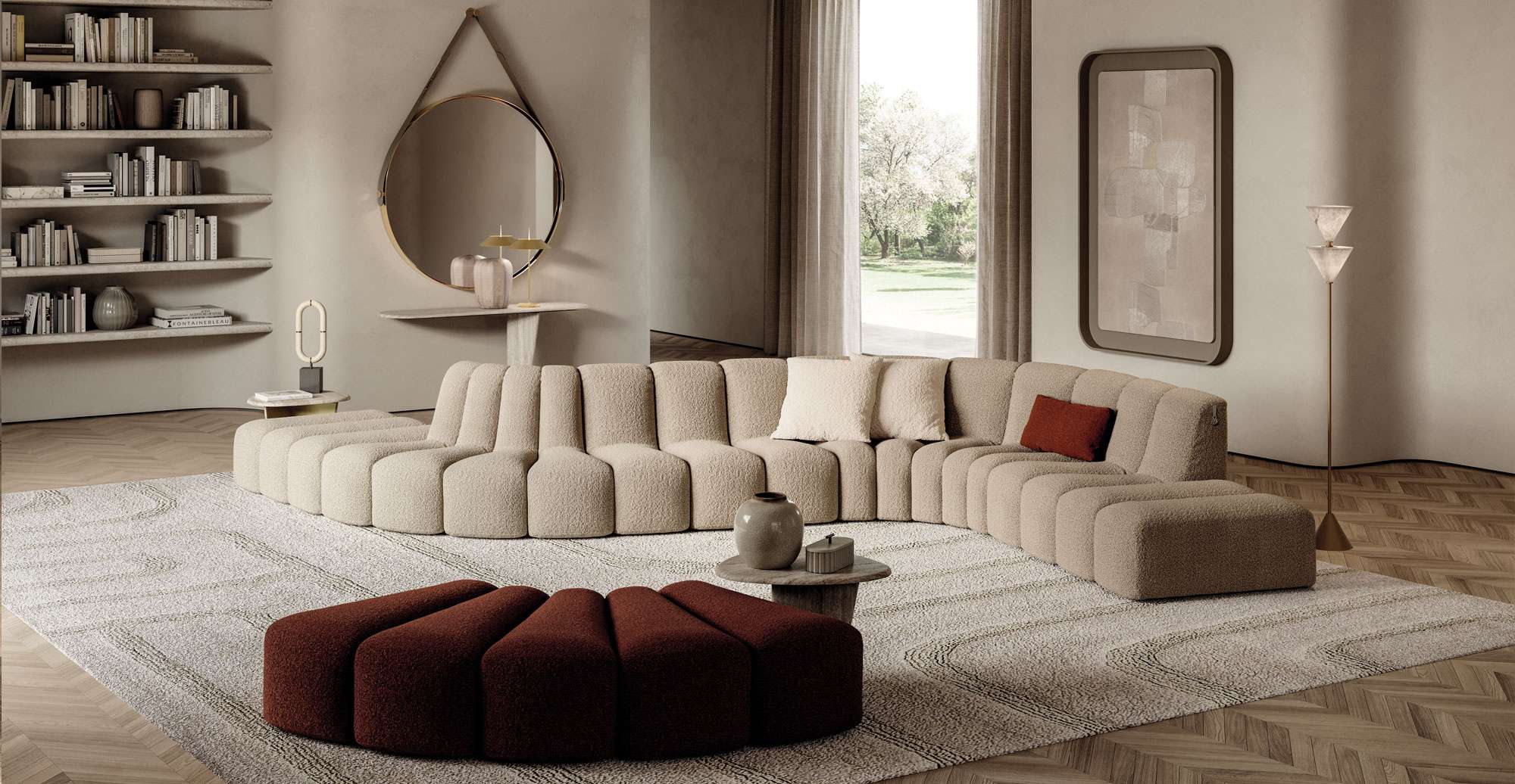 Cream channel-quilted sofa curving around a burgundy ottoman beside a garden window