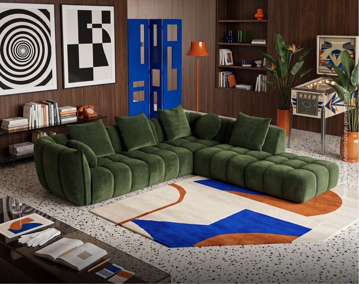 Deep green modular sofa on a patterned rug in a colourful library room