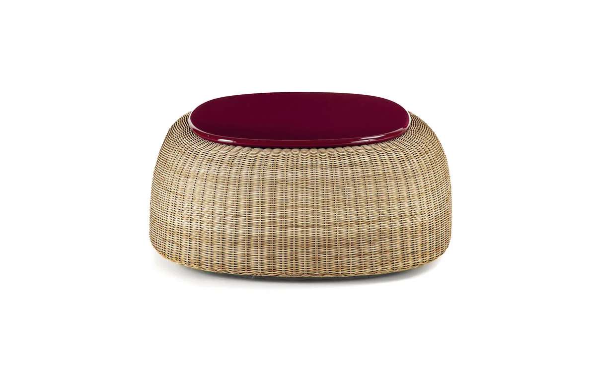 Round woven pouf with a burgundy cushion top