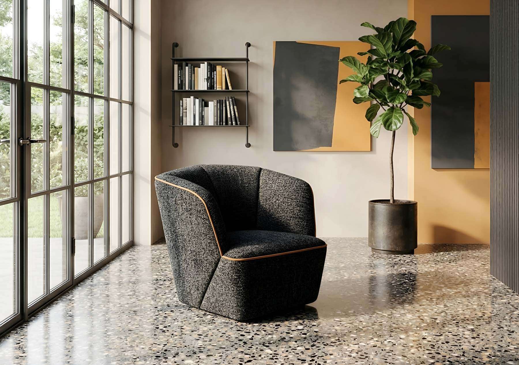 Dark armchair with a curved back on a terrazzo floor beside a tall window