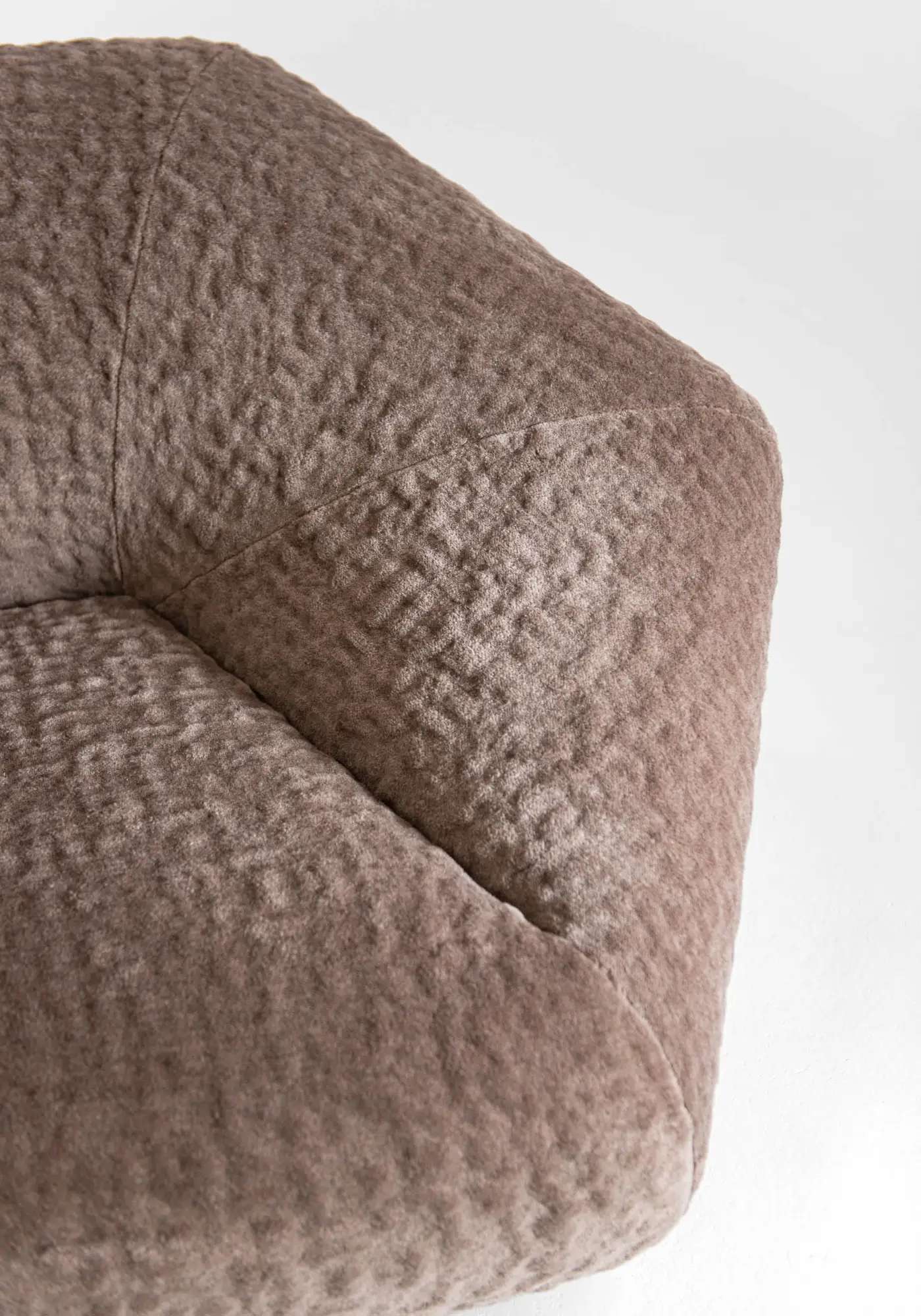 Pink upholstery with a deep hand-worked texture