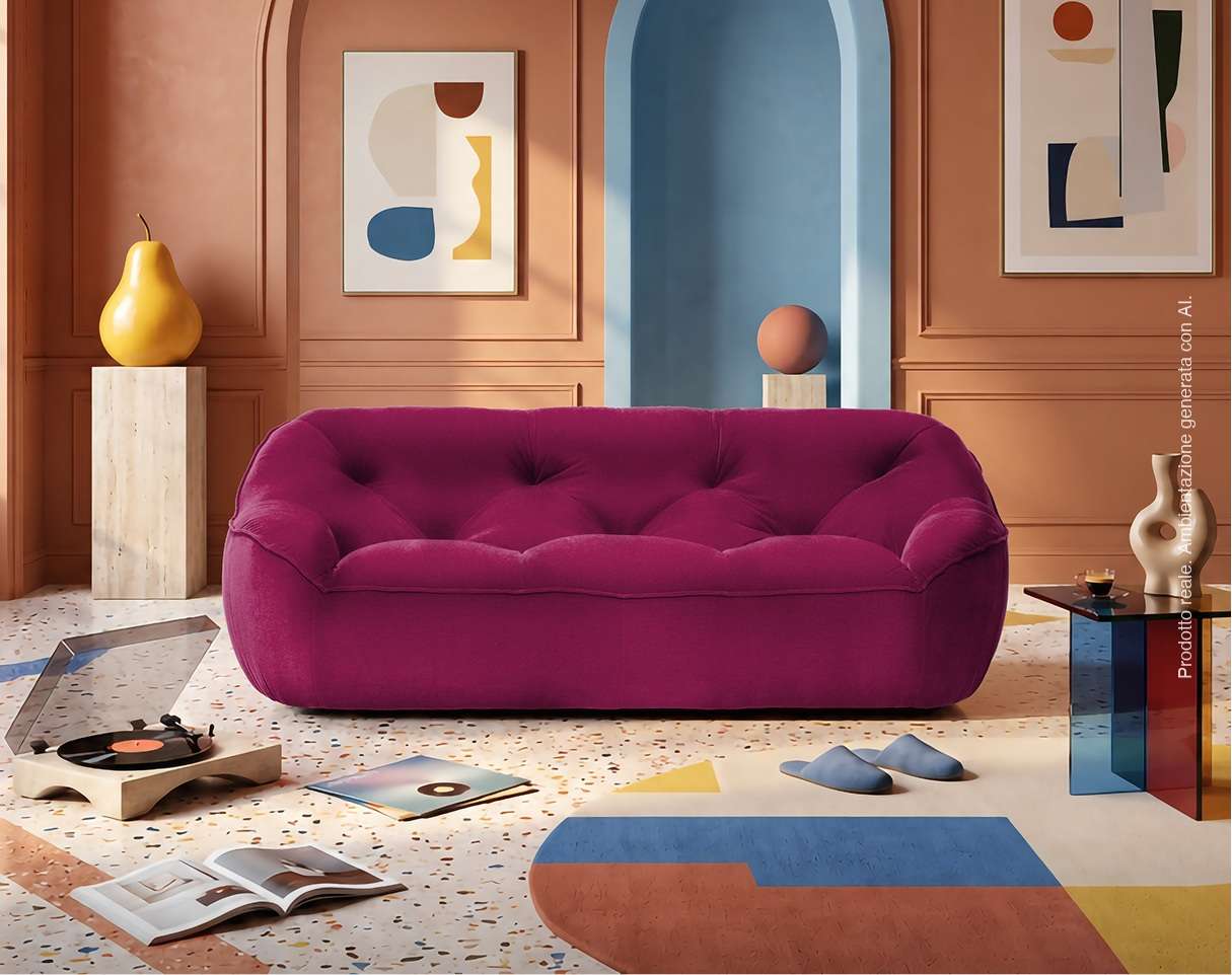 Magenta sofa with a rounded back in a terracotta room