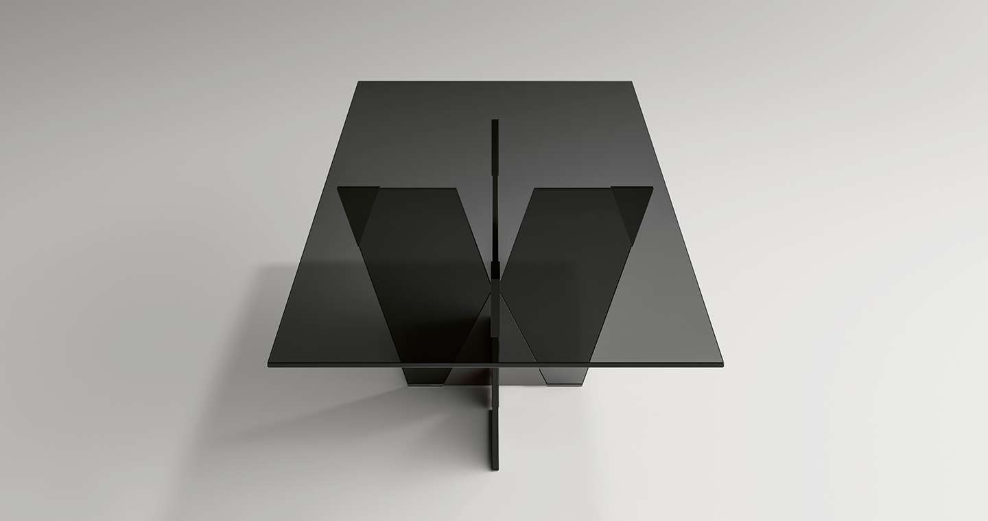 Smoked glass coffee table on crossed glass legs