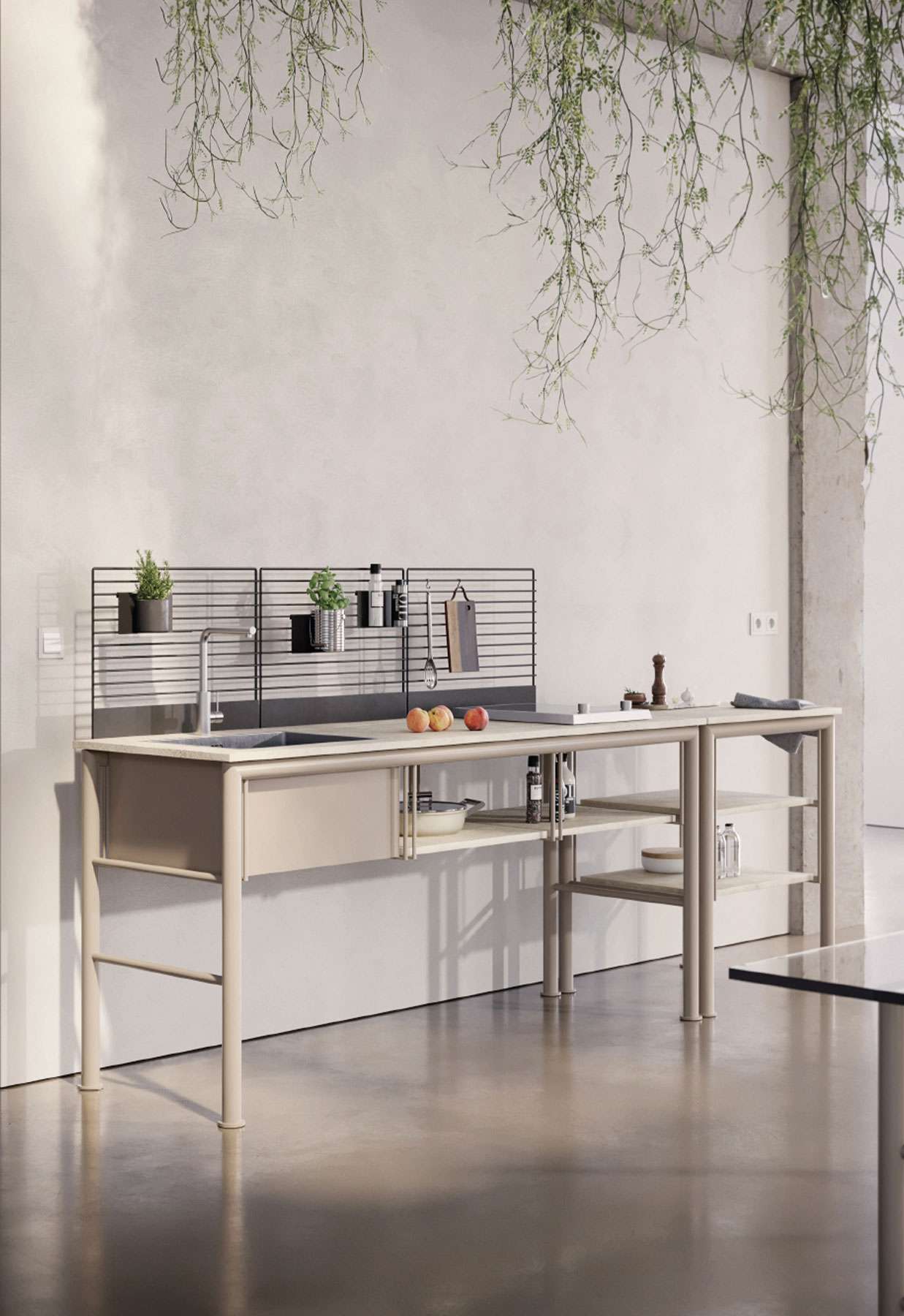 Free-standing steel kitchen unit with a rail of herbs above the sink