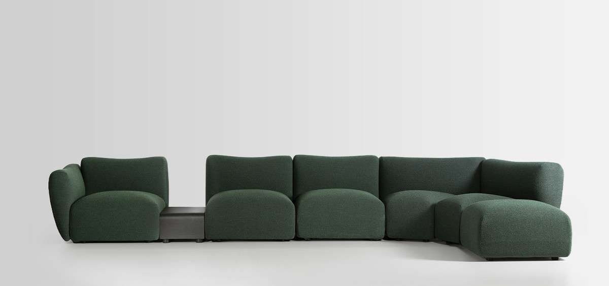 Deep green modular sofa with a low table set between its seats