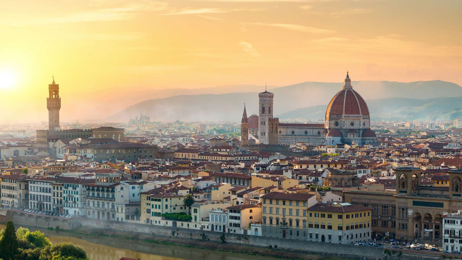 Florence at sunset with the cathedral dome and Palazzo Vecchio