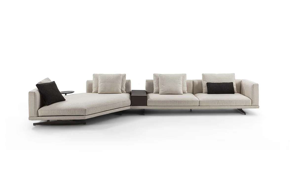 Long low modular sofa with a built-in side table