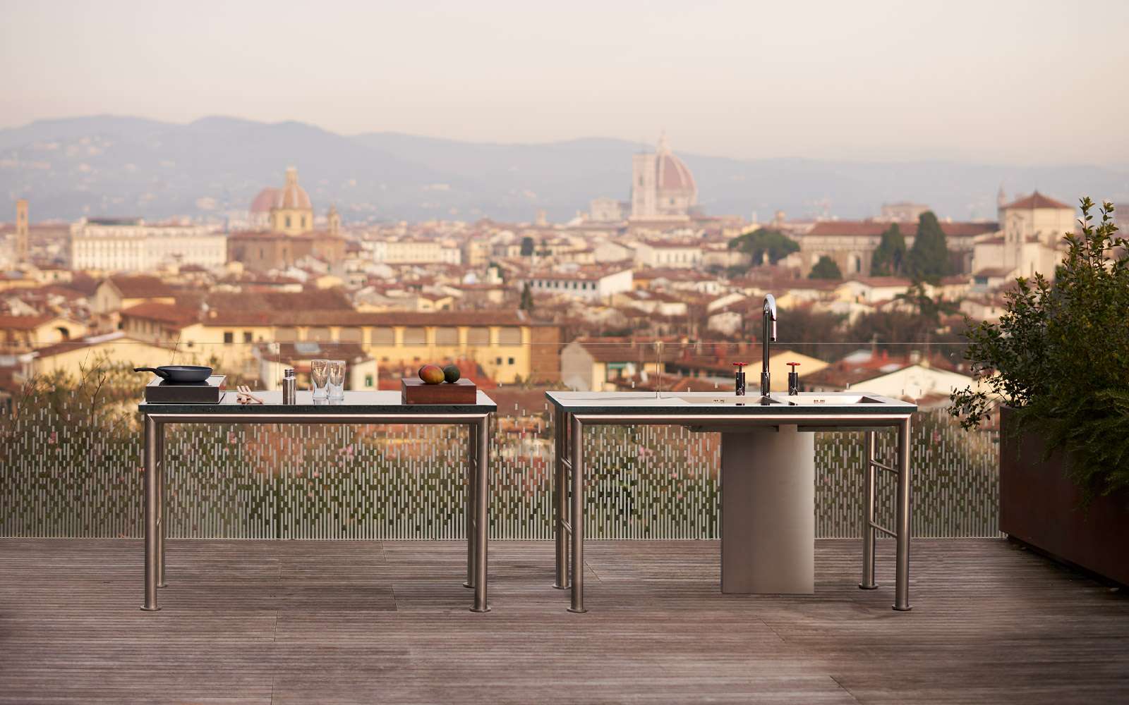 Outdoor tables on a terrace overlooking the rooftops of Florence