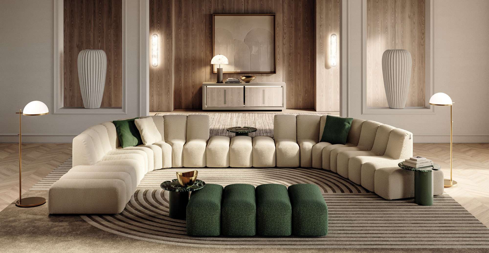 Long curved cream sofa around a green ottoman in a softly lit room