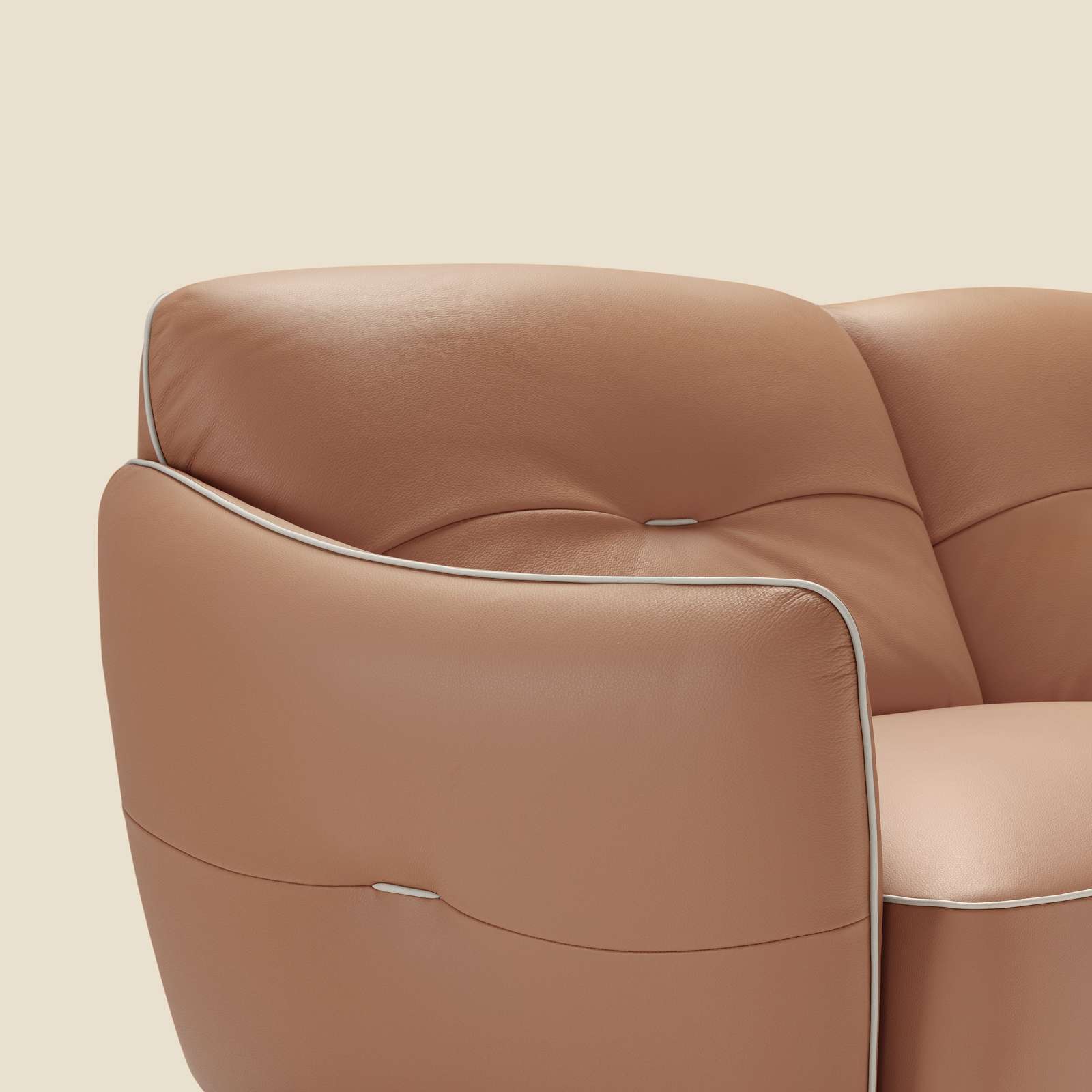 Tan leather armrest with contrast piping
