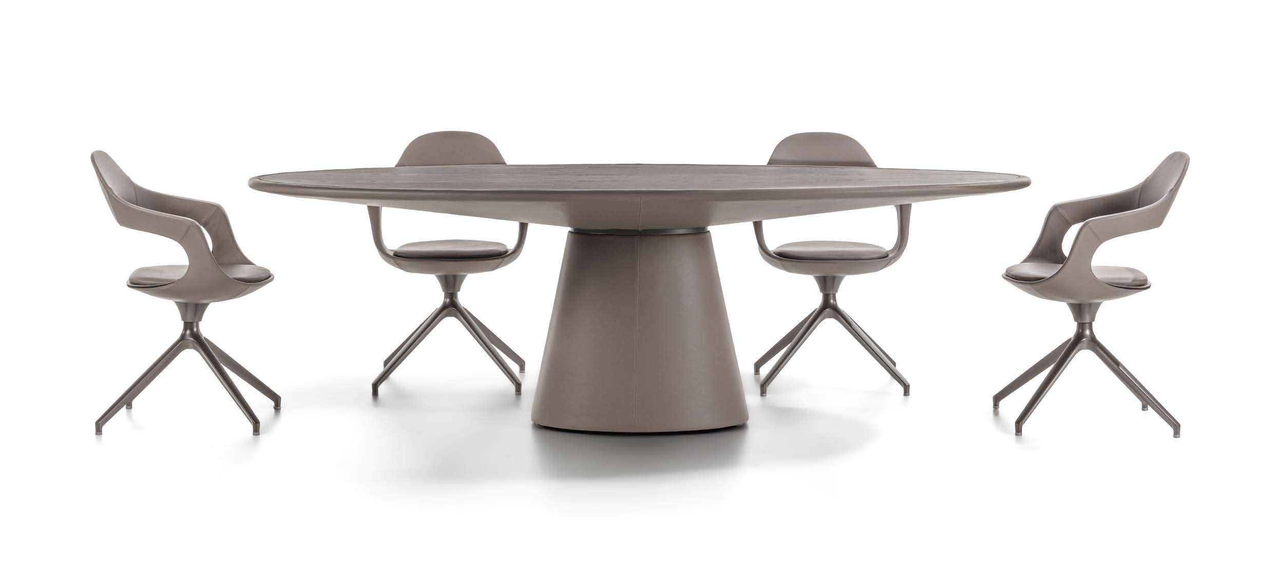 Oval table on a leather-covered cone base with matching swivel chairs