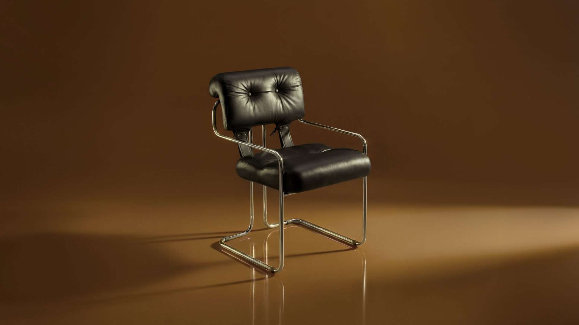 Black leather chair with a chrome frame against a bronze background