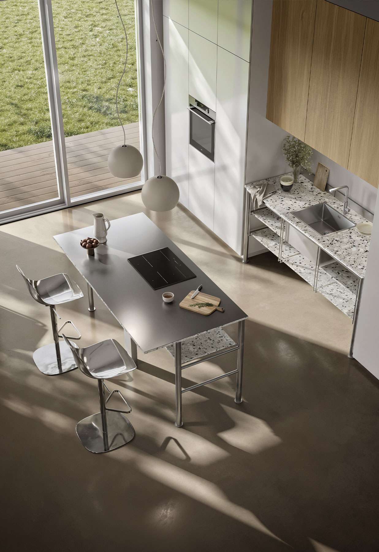 Kitchen island with a steel top and stools, seen from above