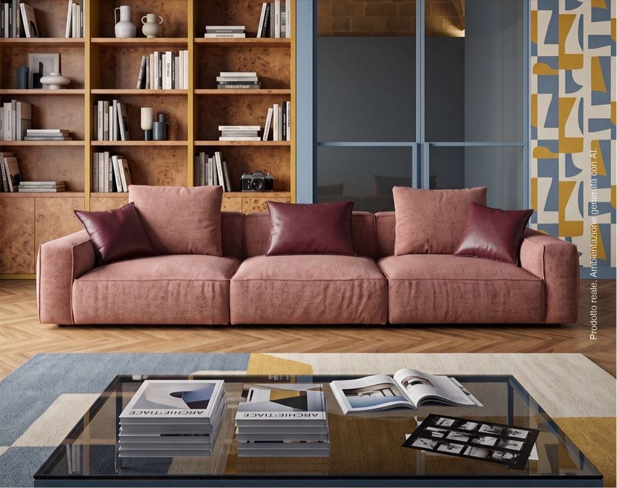 Dusty pink sofa below wooden bookshelves