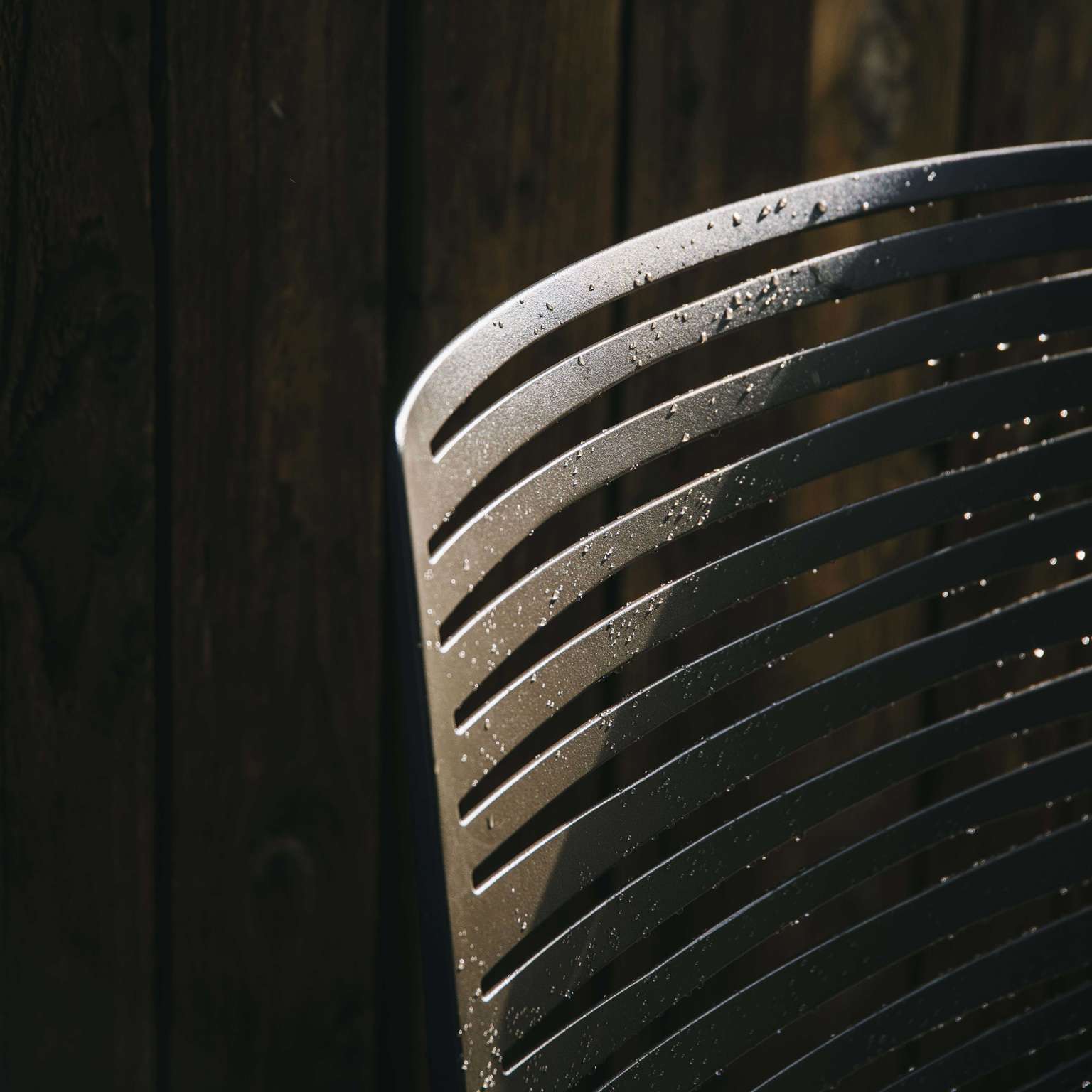 Close-up of the slatted aluminium back of a chair