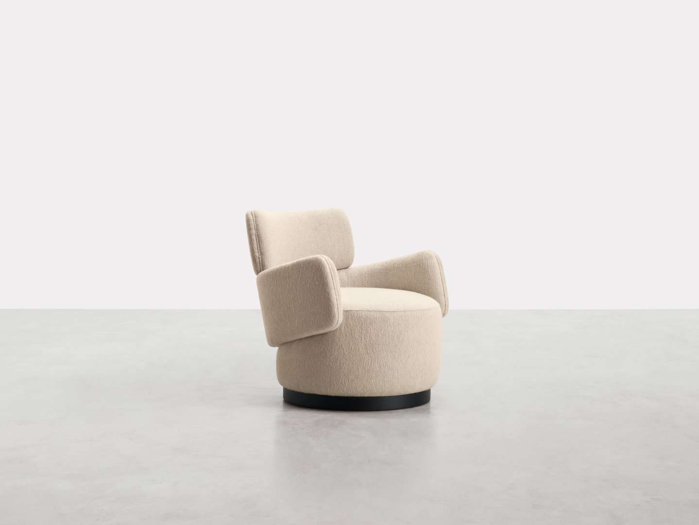 Ivory swivel armchair with a curved back