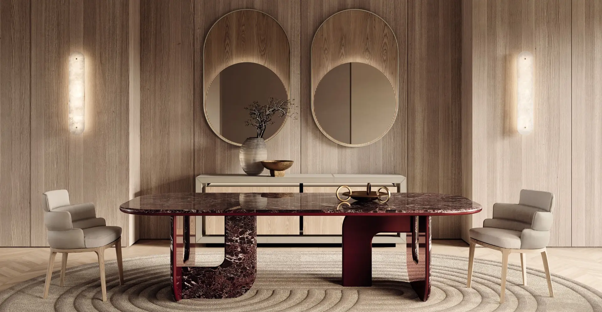 Dining room with a dark red marble table, upholstered chairs and two round mirrors on a timber wall